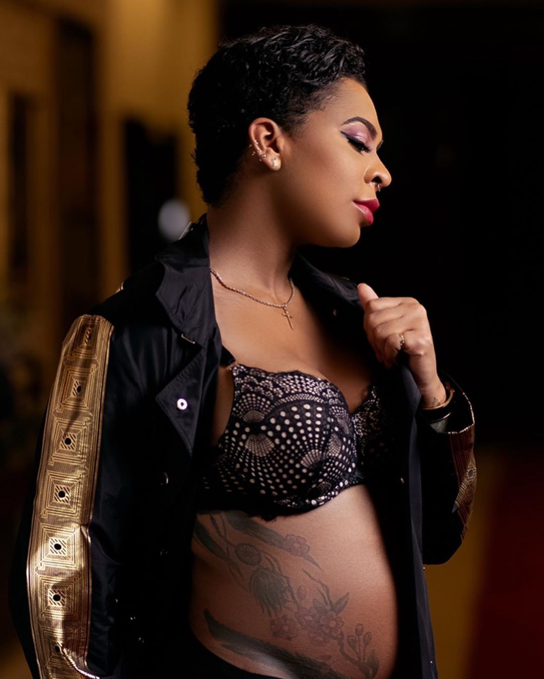 TBoss rock baby bump in promo photos
