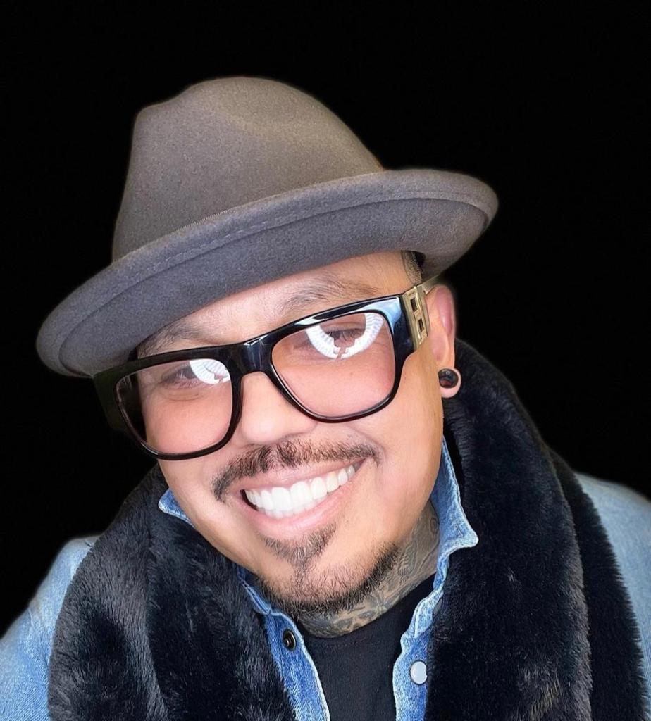A.B. Quintanilla performing with his musical instruments