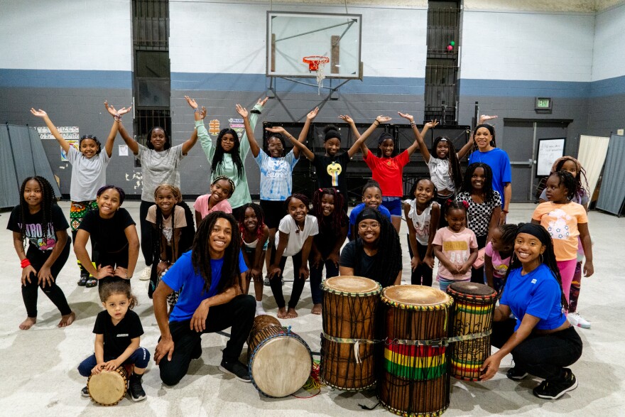Young African children participating in a dance therapy session