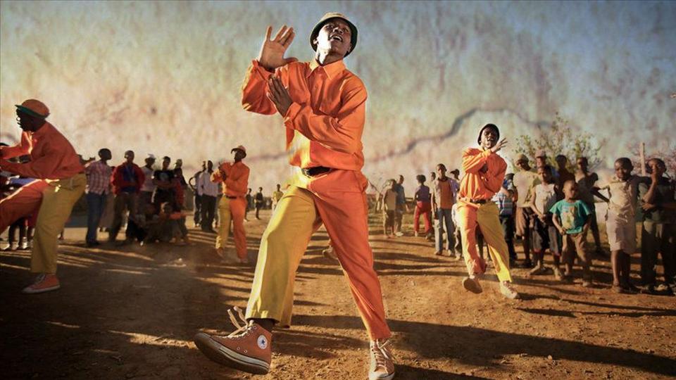 South African children learning dance in a township community center