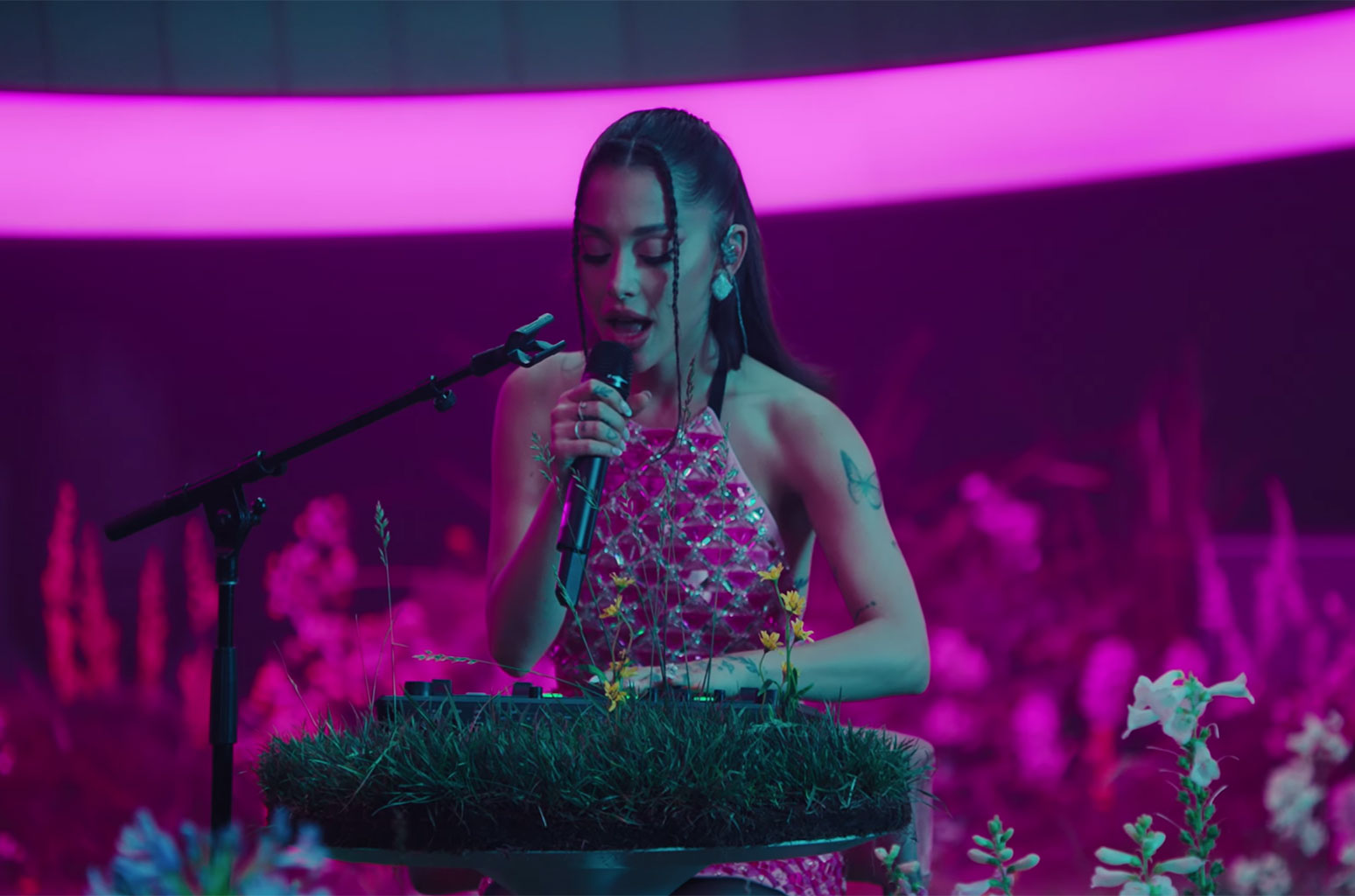 Ariana Grande performing on stage during a live concert