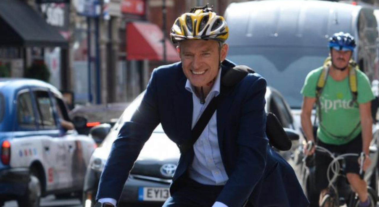 Celebrities riding bicycles in urban settings