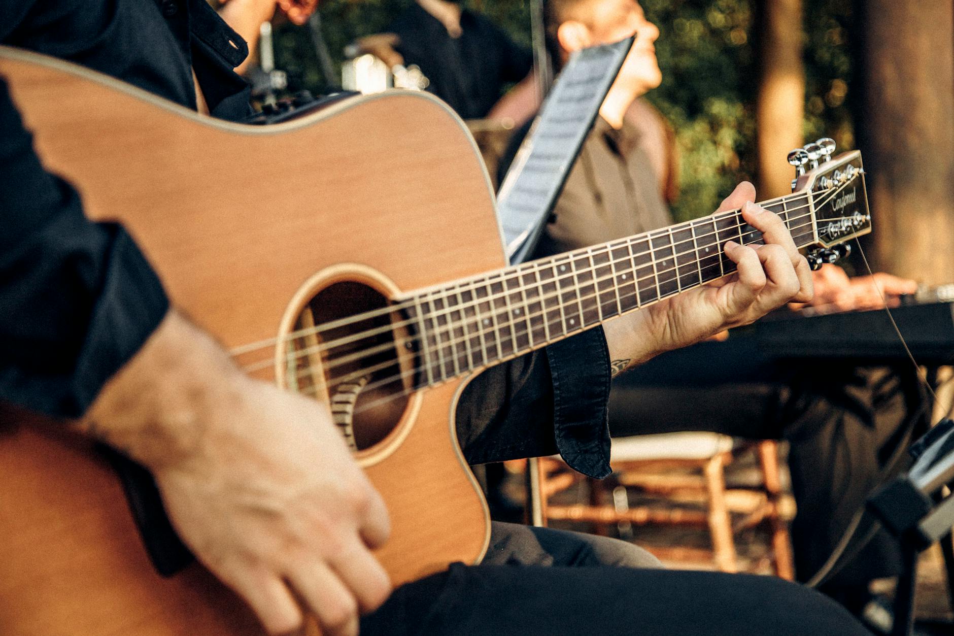 Chase Matthew performing acoustic guitar
