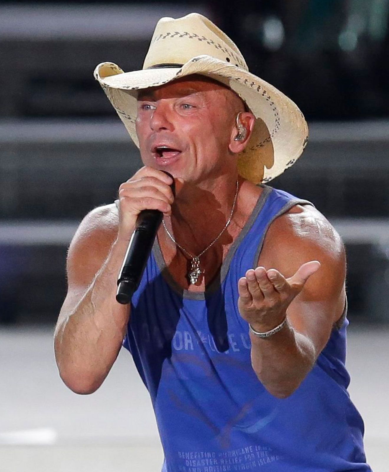 Kenny Chesney performing at outdoor concert venue