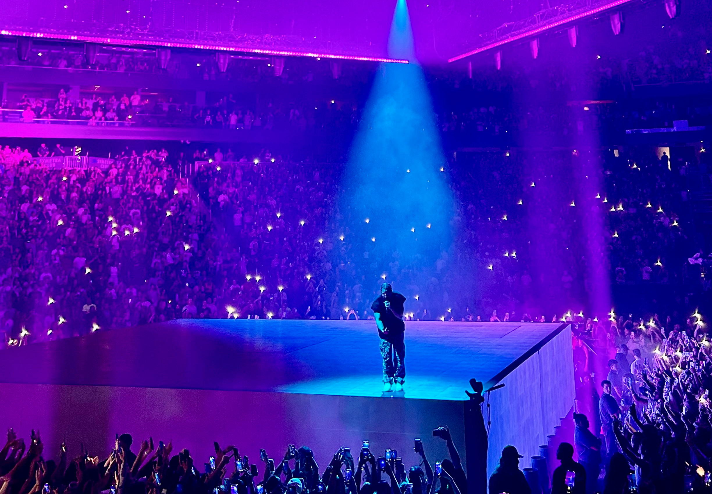 Drake performing live on stage in recent concert