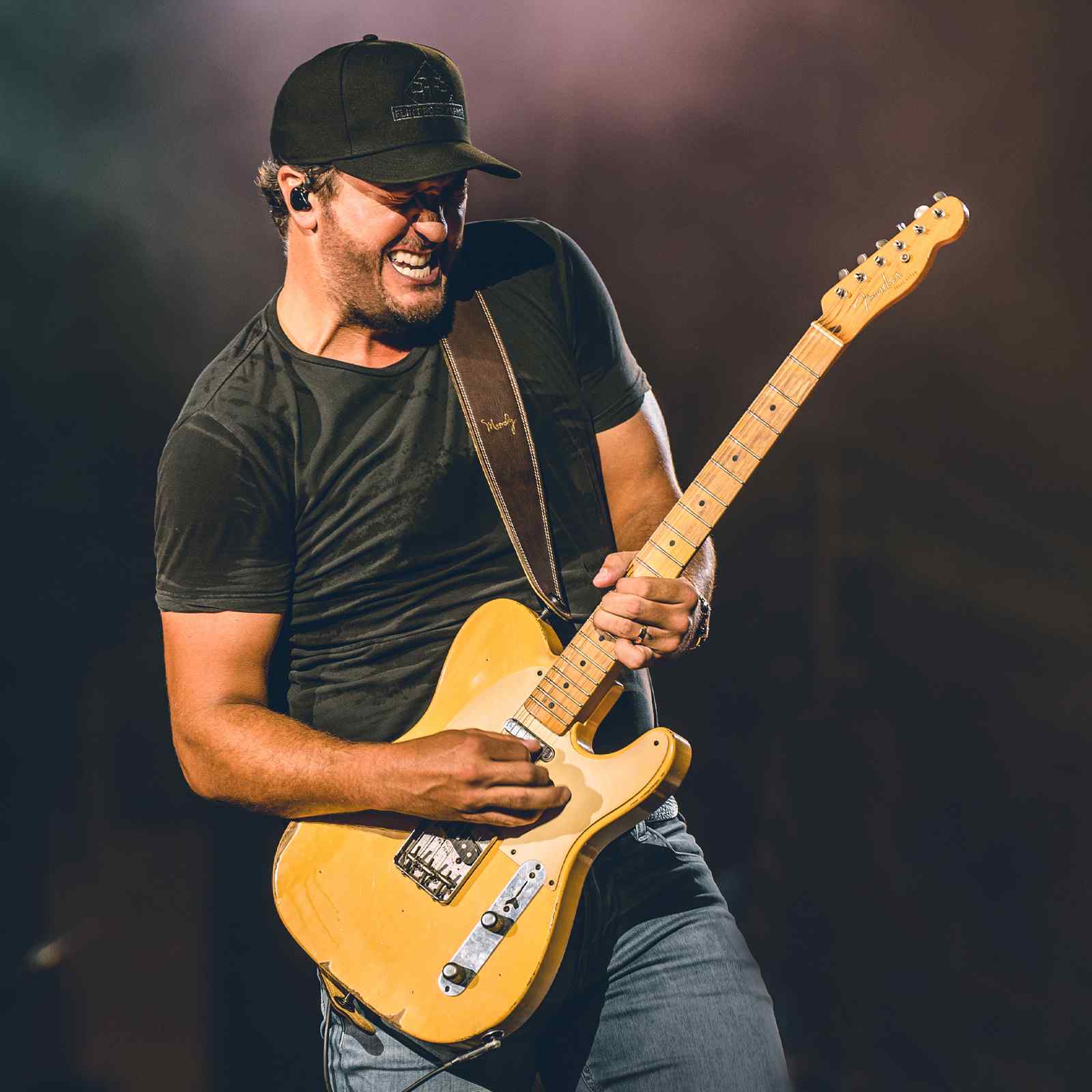 Luke Bryan performing live on stage at a country music concert