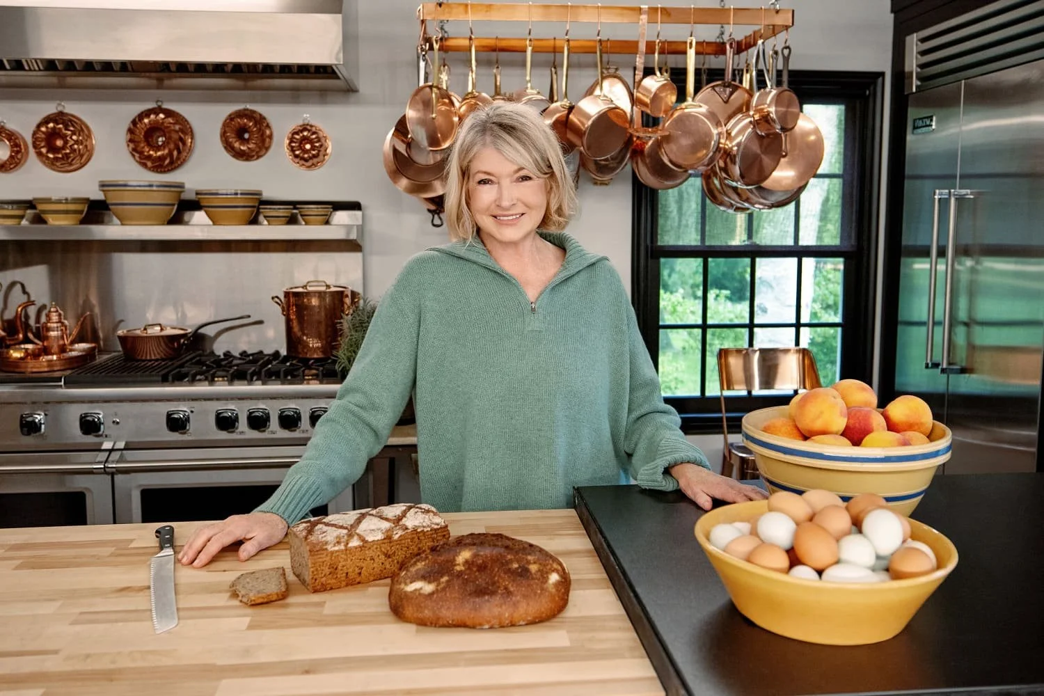 Martha Stewart preparing food in her kitchen