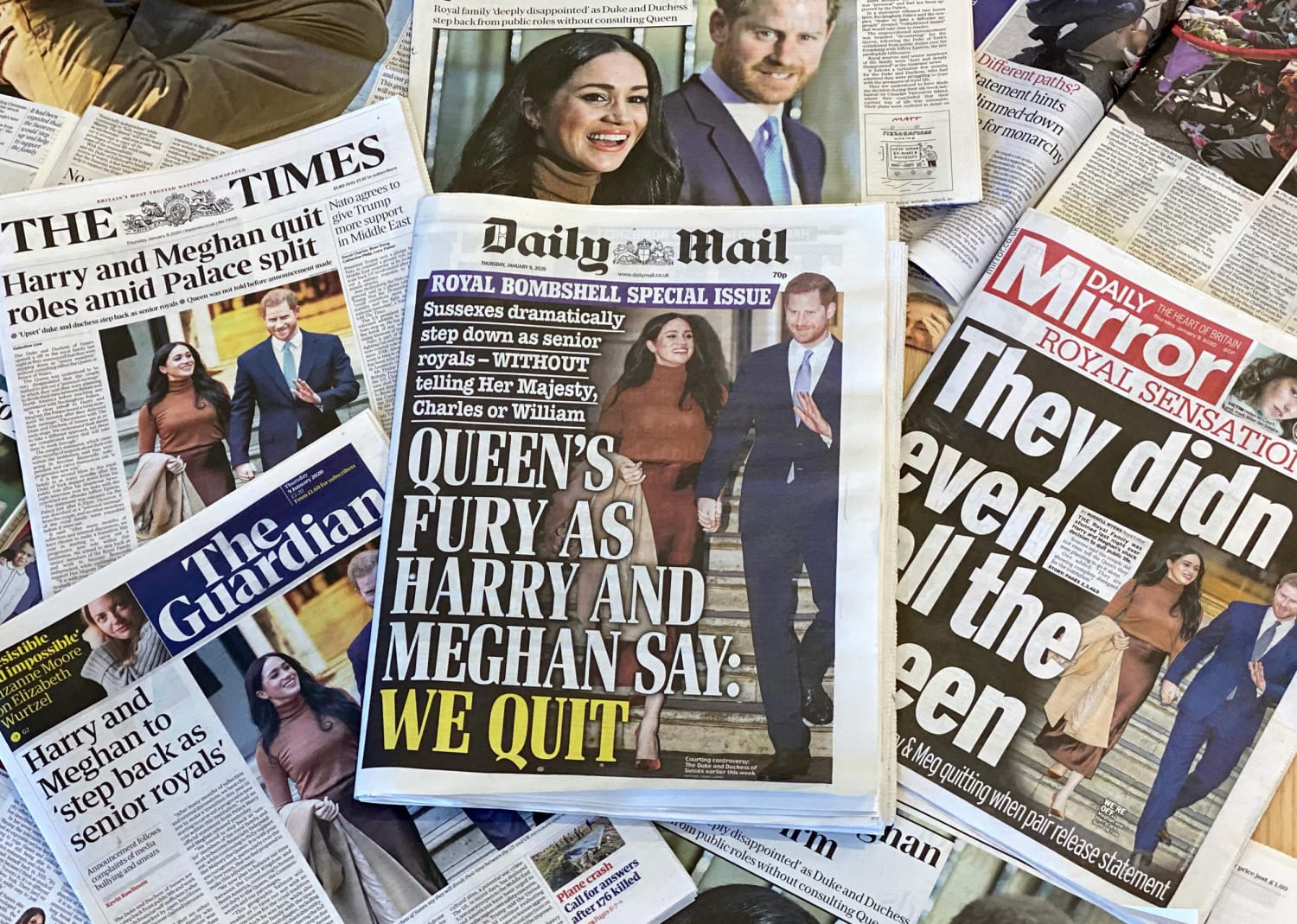 Meghan Markle and Prince Harry surrounded by media attention