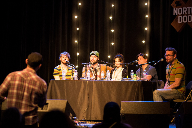 Music industry executives networking at conference event