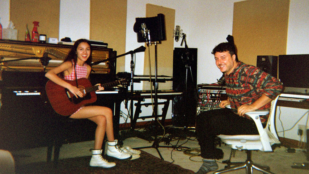 Olivia Rodrigo in a recording studio working on music