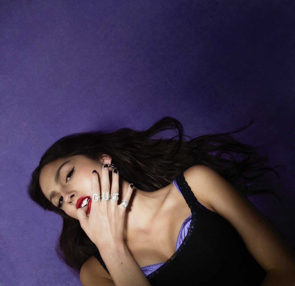 Olivia Rodrigo promoting her album GUTS