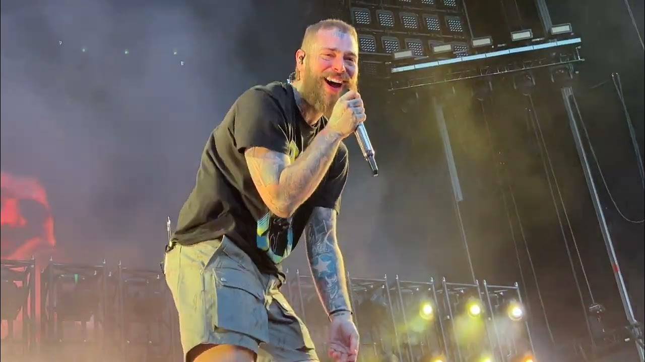 Post Malone performing live for a large audience
