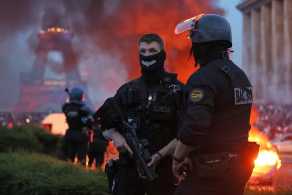 French riot police managing crowd control during PSG celebrations