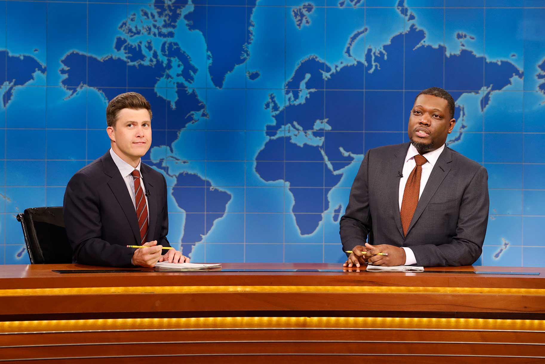 Colin Jost and Michael Che at the Weekend Update desk on Saturday Night Live