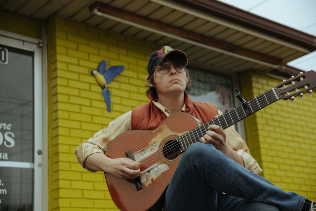 Stephen Wilson Jr. with acoustic guitar in recording studio