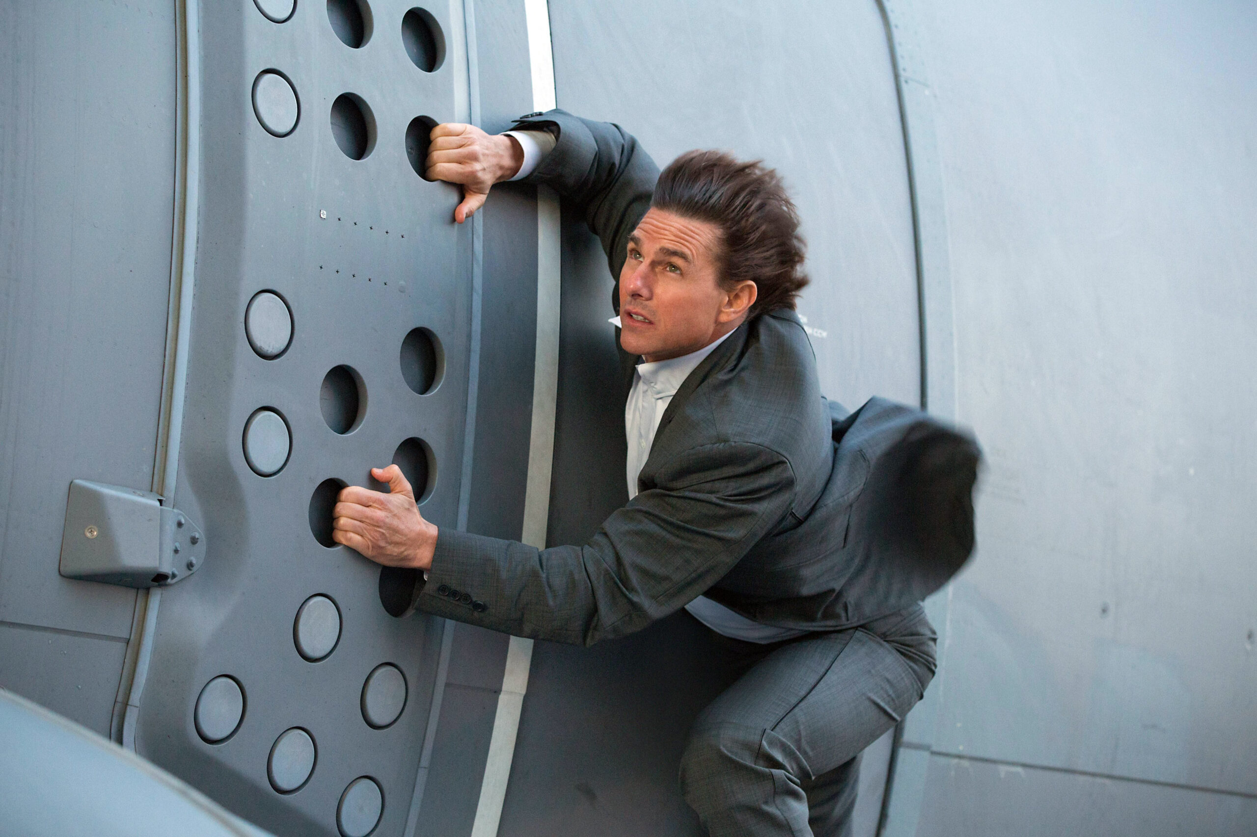 Tom Cruise performing stunts in Mission Impossible films