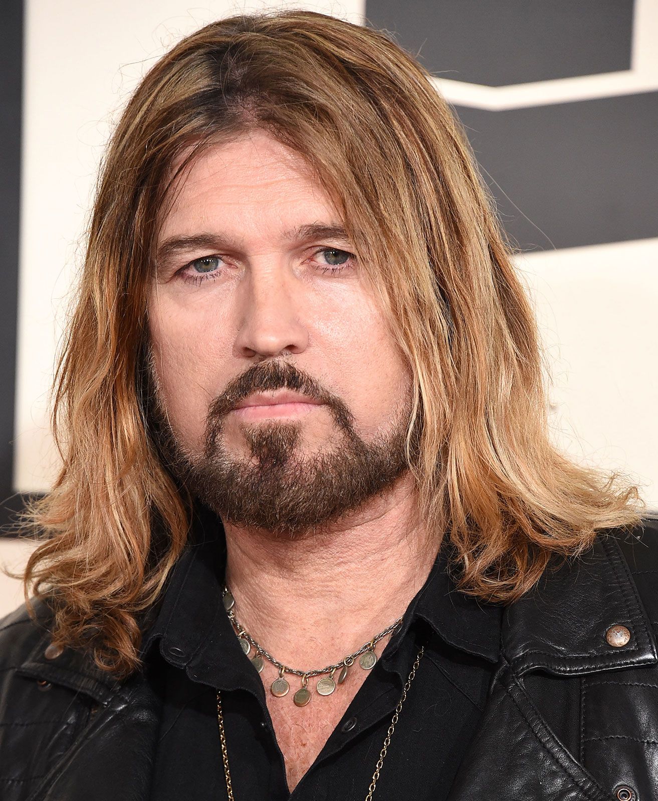 Billy Ray Cyrus performing on stage