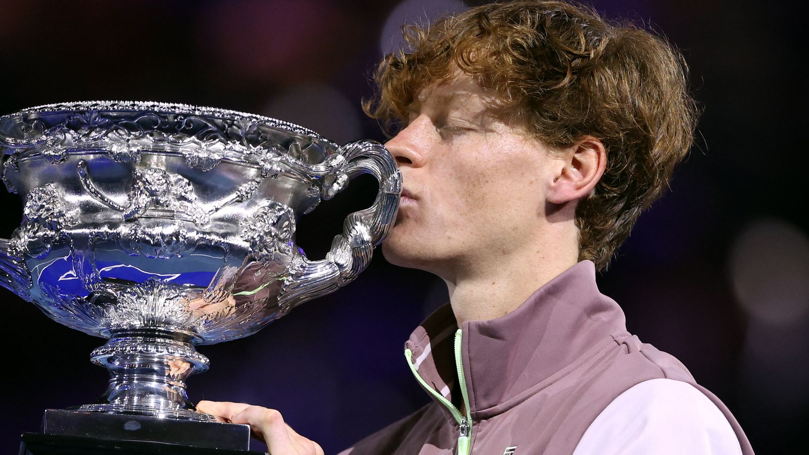 Jannik Sinner lifting the Australian Open 2024 trophy