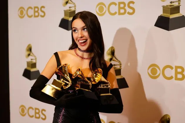 Olivia Rodrigo at the Grammy Awards celebrating her major career achievements