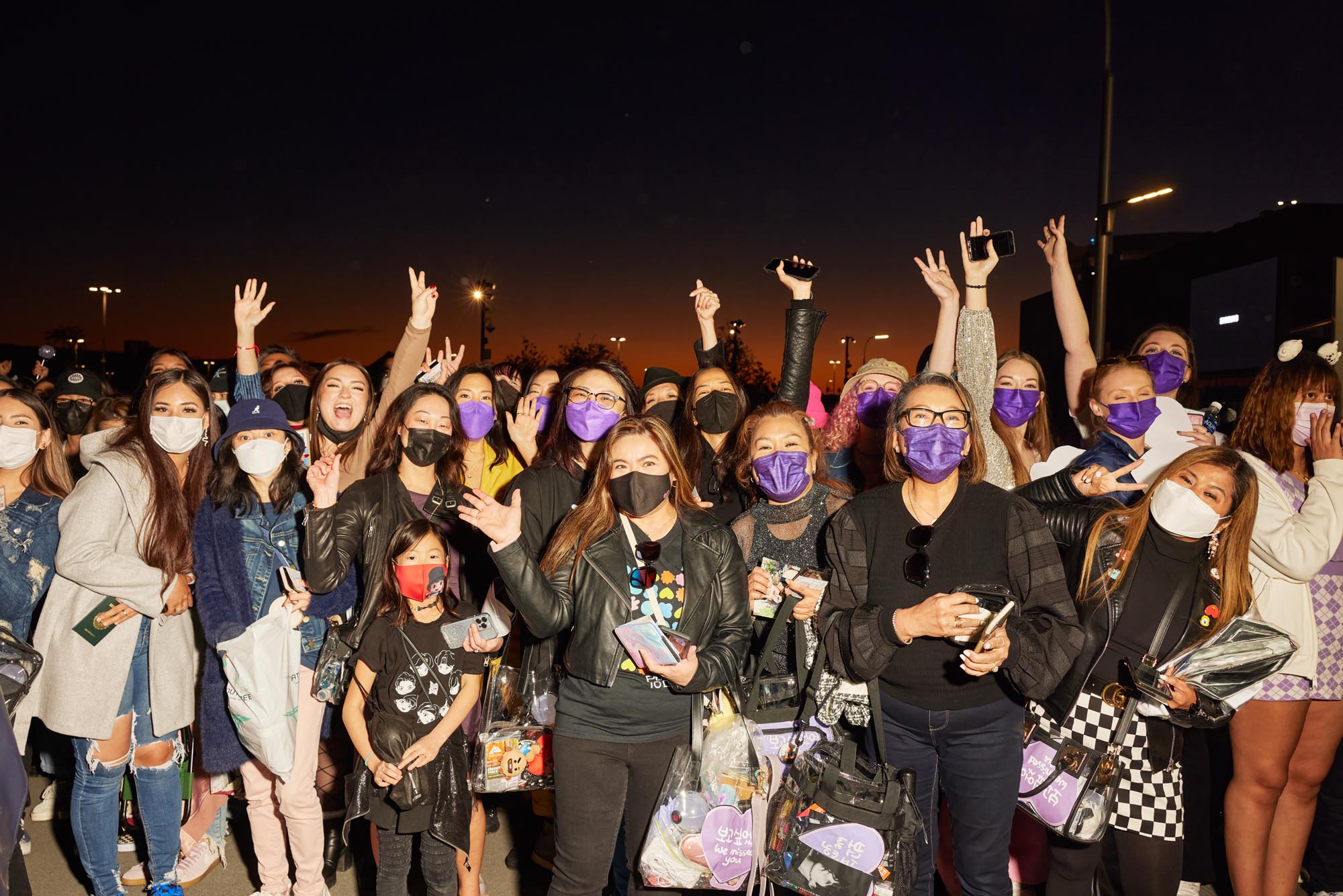 BTS fans celebrating at a concert venue