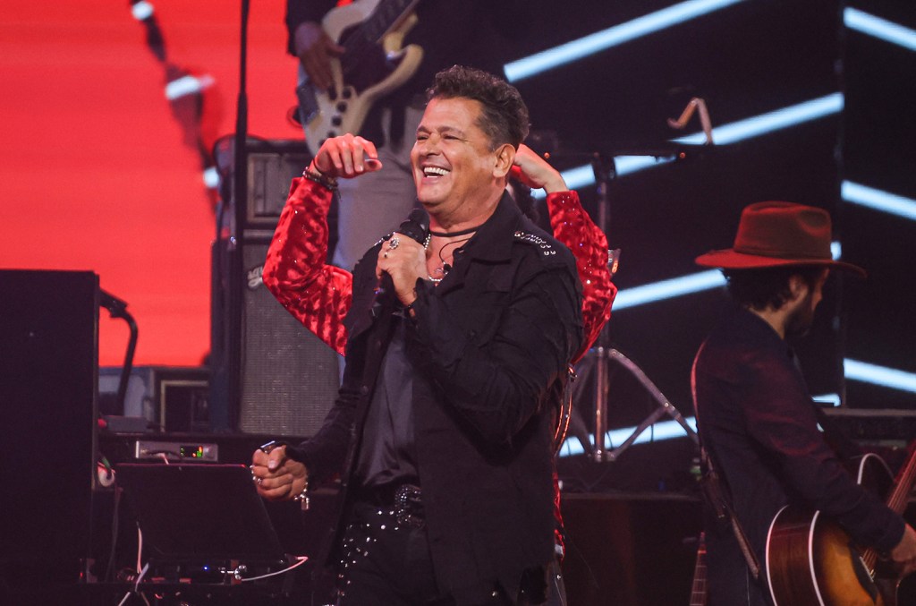 Carlos Vives on stage performing vallenato music