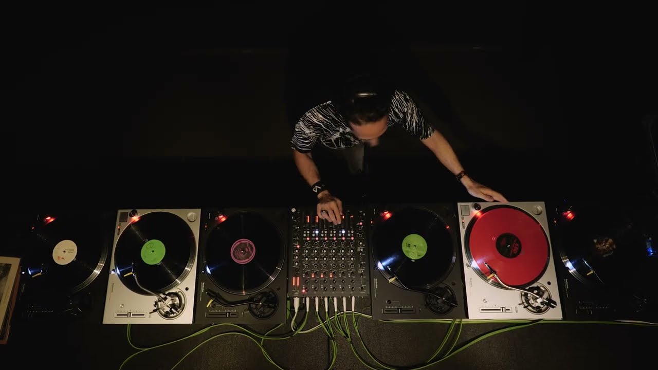DJ AG working turntables at live performance