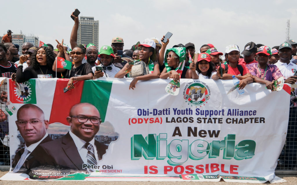 Political campaign event in Nigeria with supporters and banners