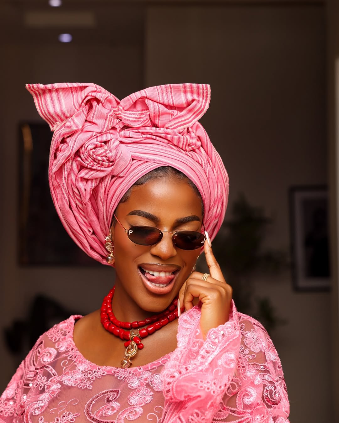 Hilda Baci wearing coral beads and gele headwrap