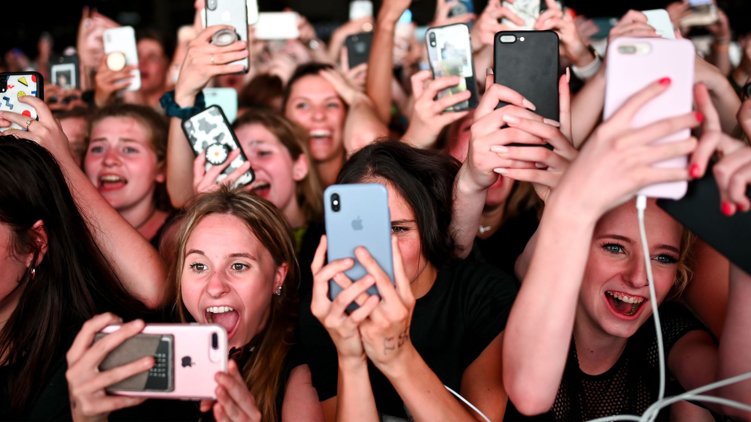 Fans using smartphones to record celebrity encounters
