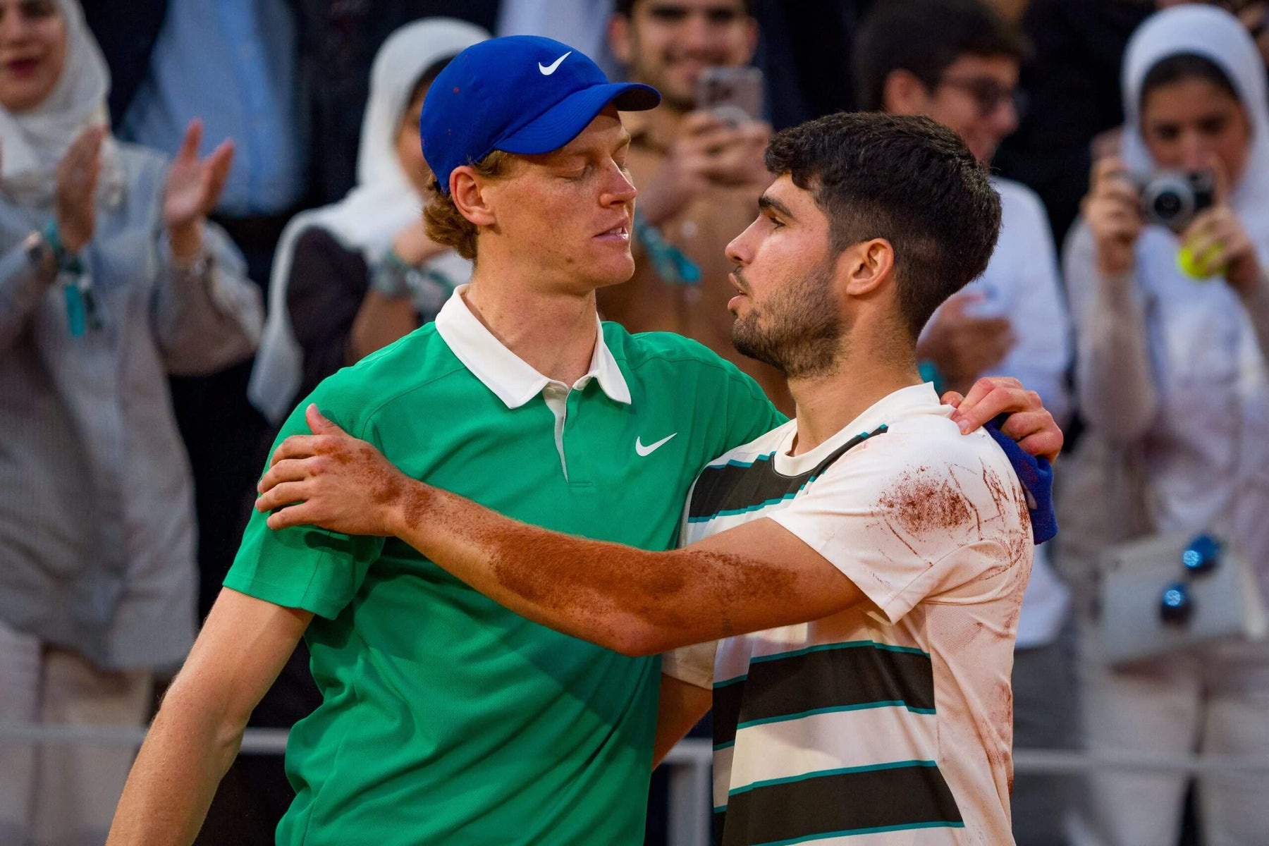Jannik Sinner and Carlos Alcaraz competing at a Grand Slam tournament