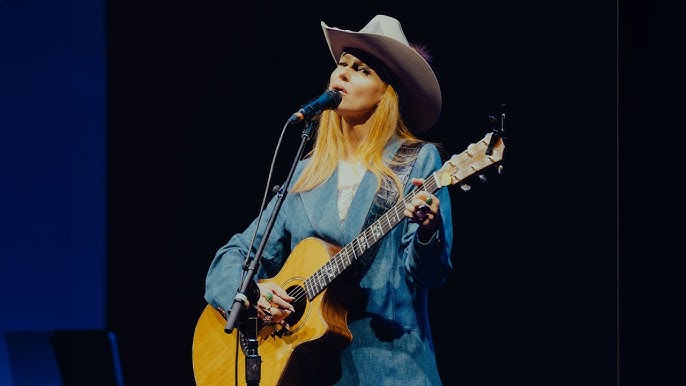Jewel performing live on stage during a concert