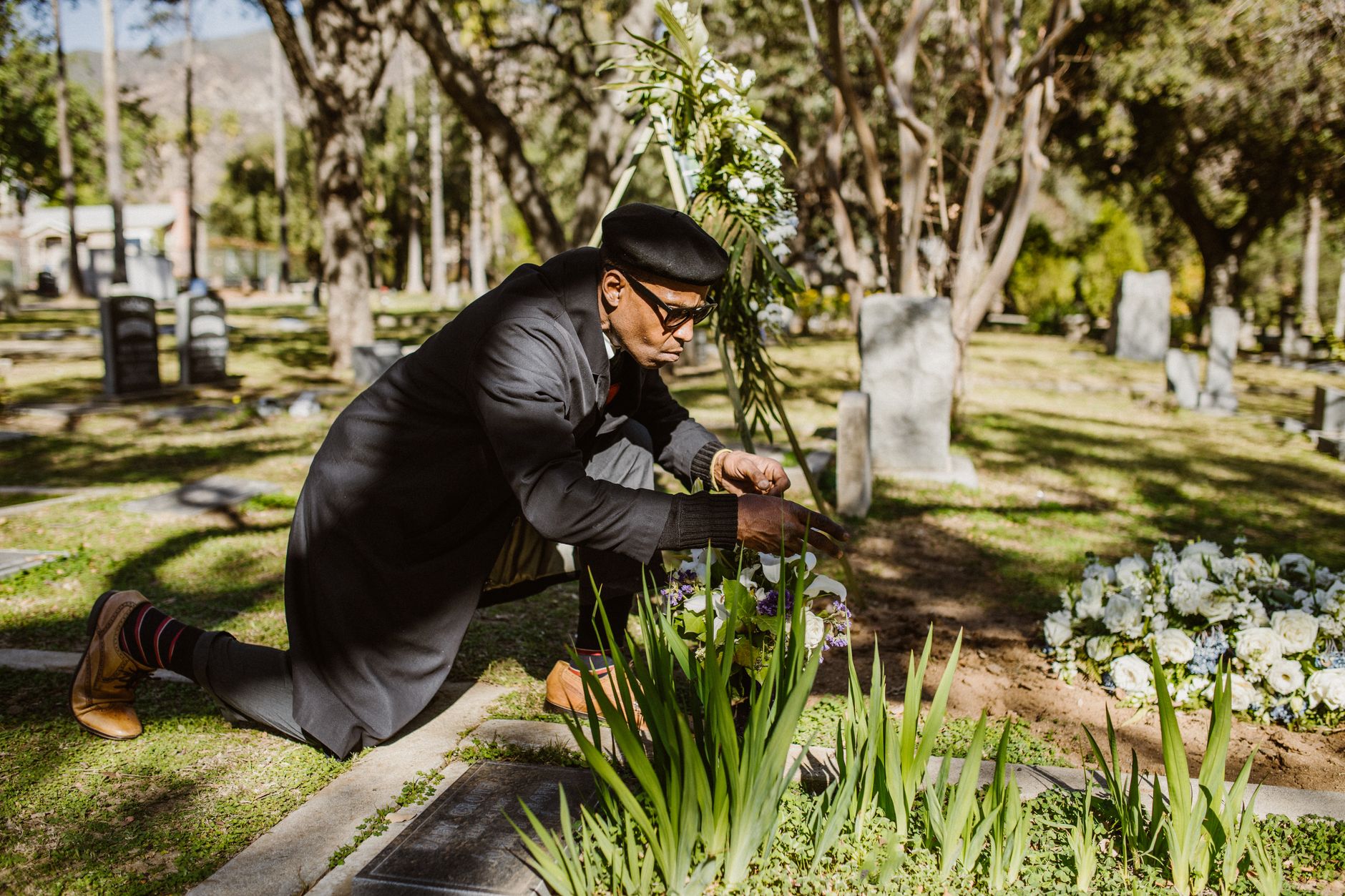 Chrissy Teigen and John Legend paying tribute to Papa Ron