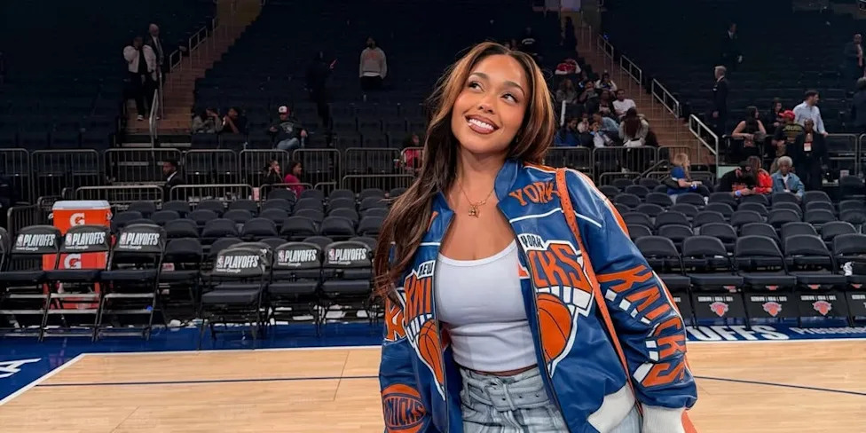 Jordyn Woods cheering at basketball game