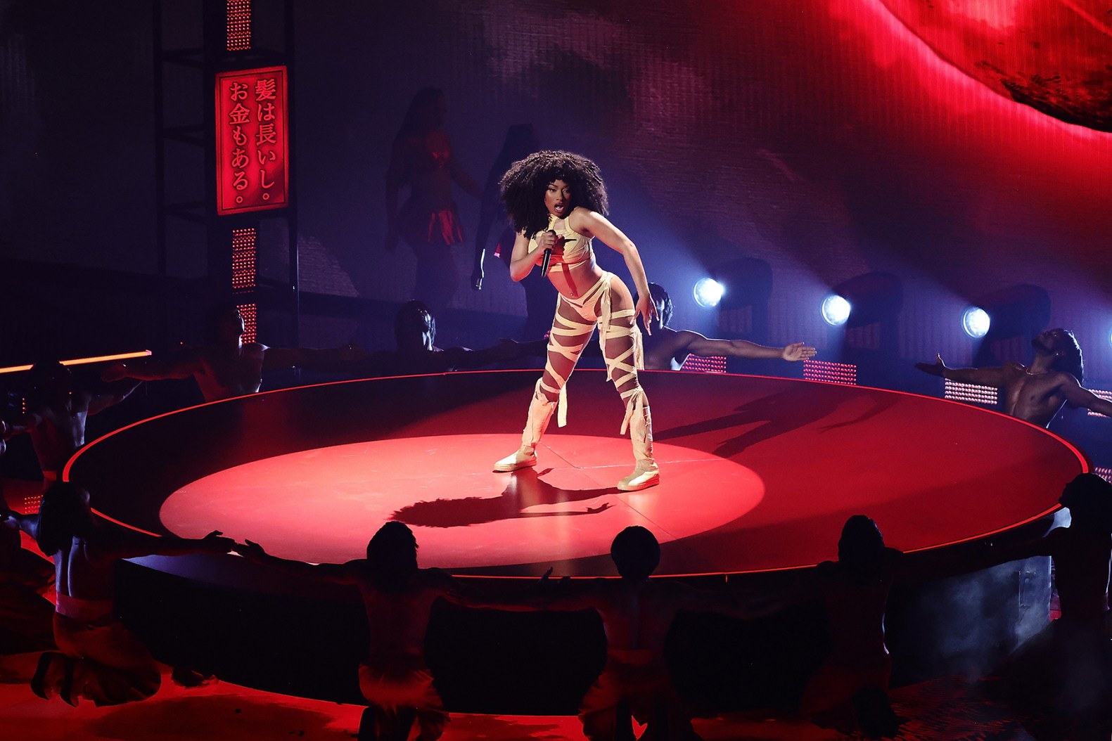 Megan Thee Stallion performing at a live event in 2024