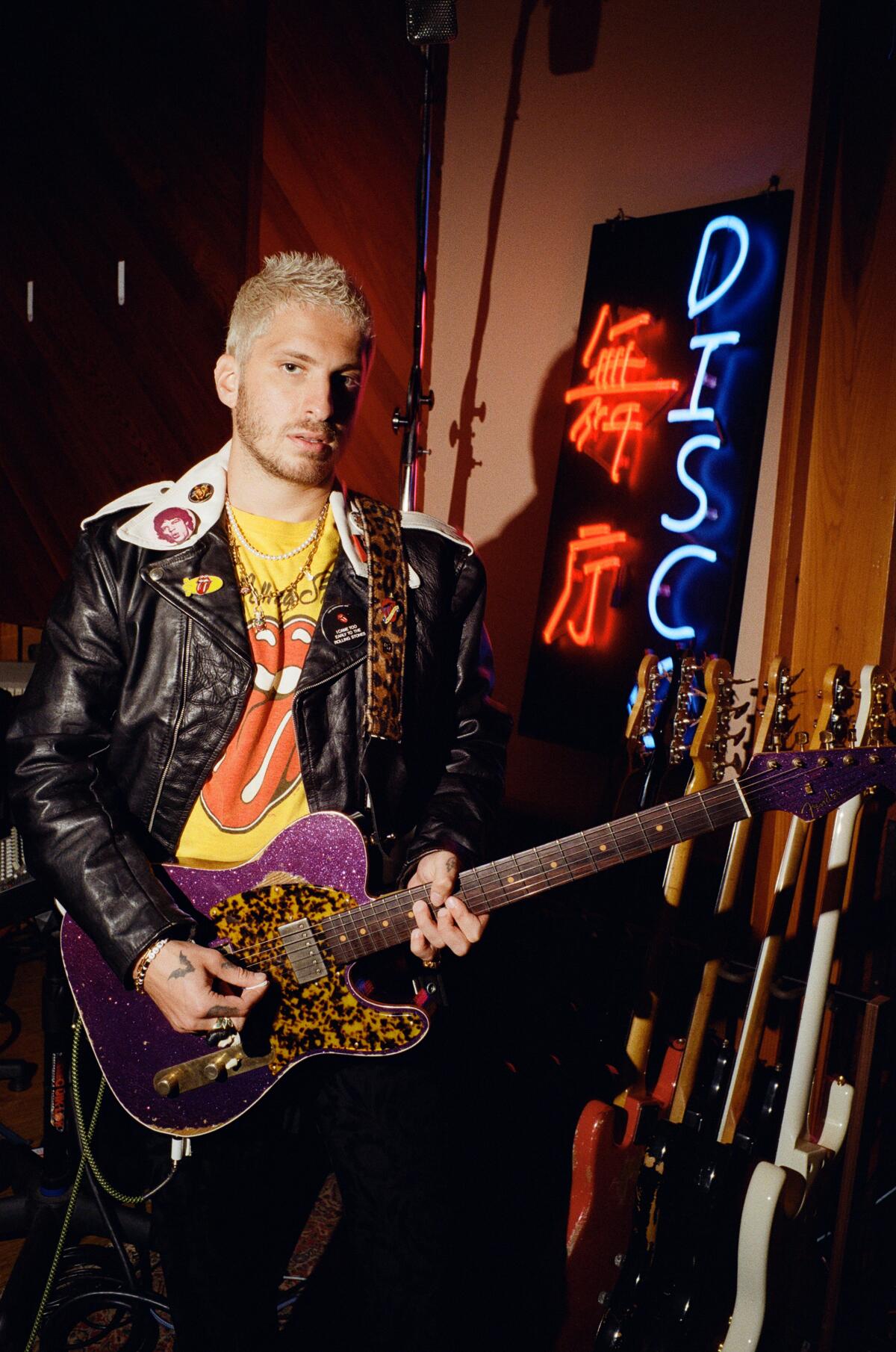 Andrew Watt with guitar in recording studio