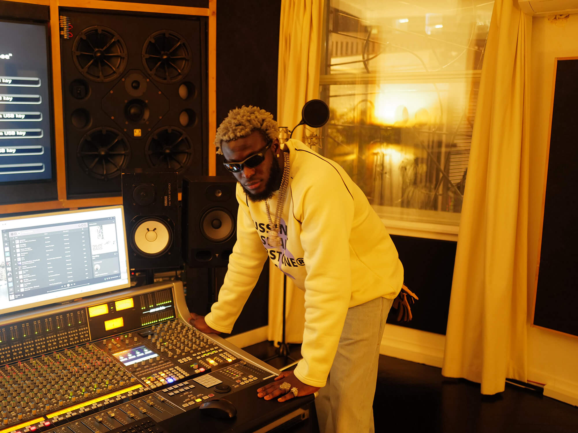 Nigerian Afrobeats musicians in modern recording studio