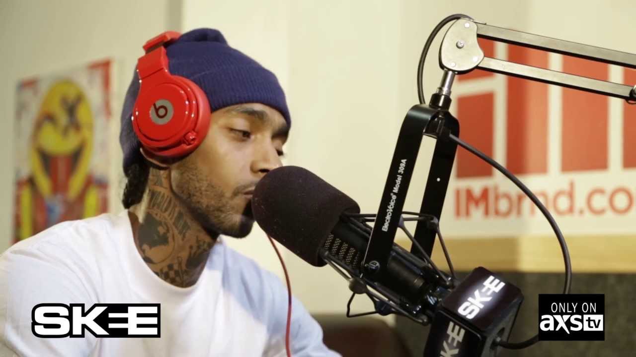 Nipsey Hussle recording vocals in a professional studio setting