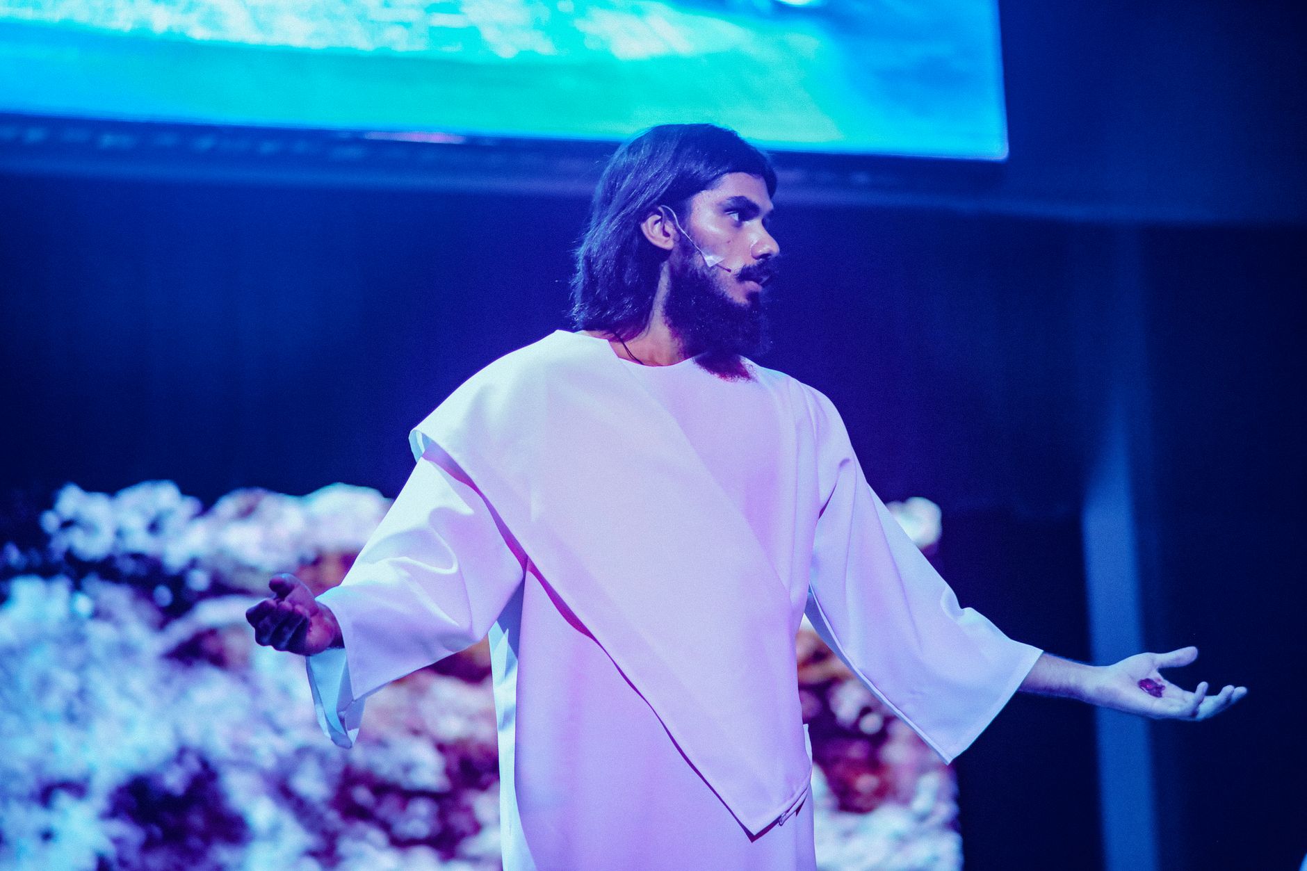 Oliver Tree performing on stage in his signature look