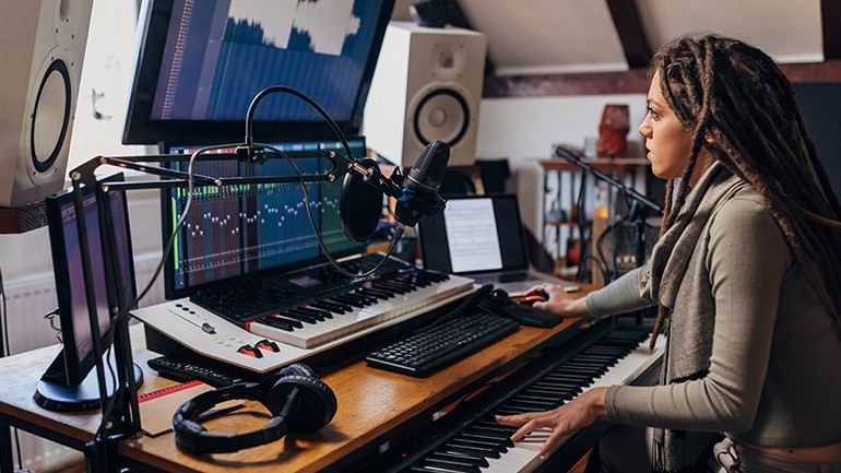 Independent musicians recording in a studio