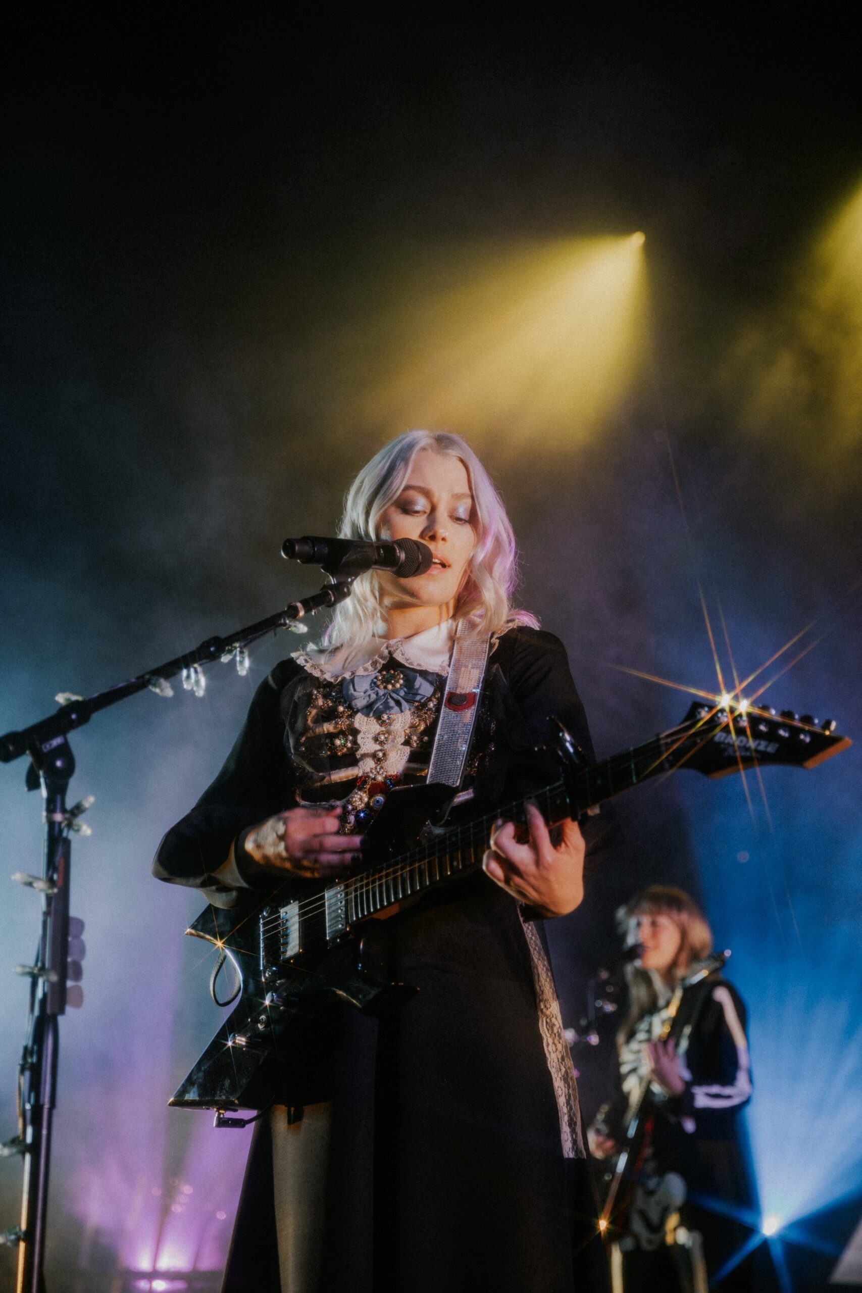 Phoebe Bridgers performing at an intimate live show