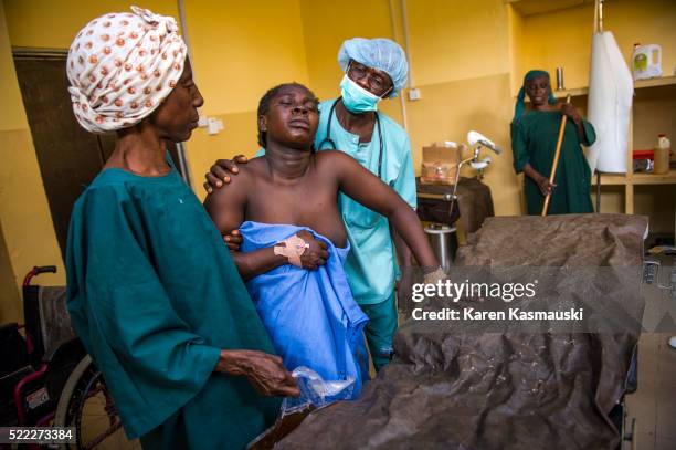 Nigerian families receiving healthcare at a community clinic