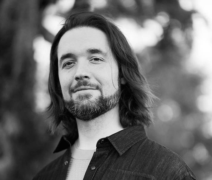 Alexis Ohanian speaking at a business or sports event