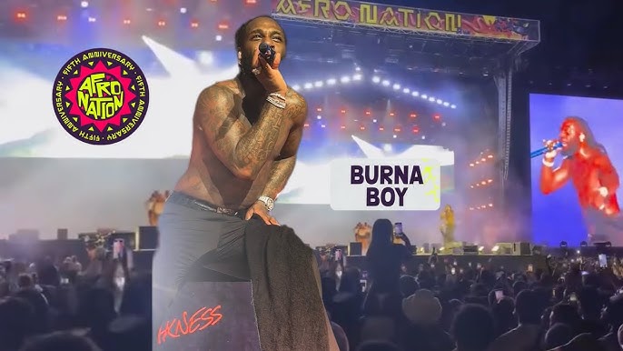 Burna Boy performing Afrobeats music live in 2025