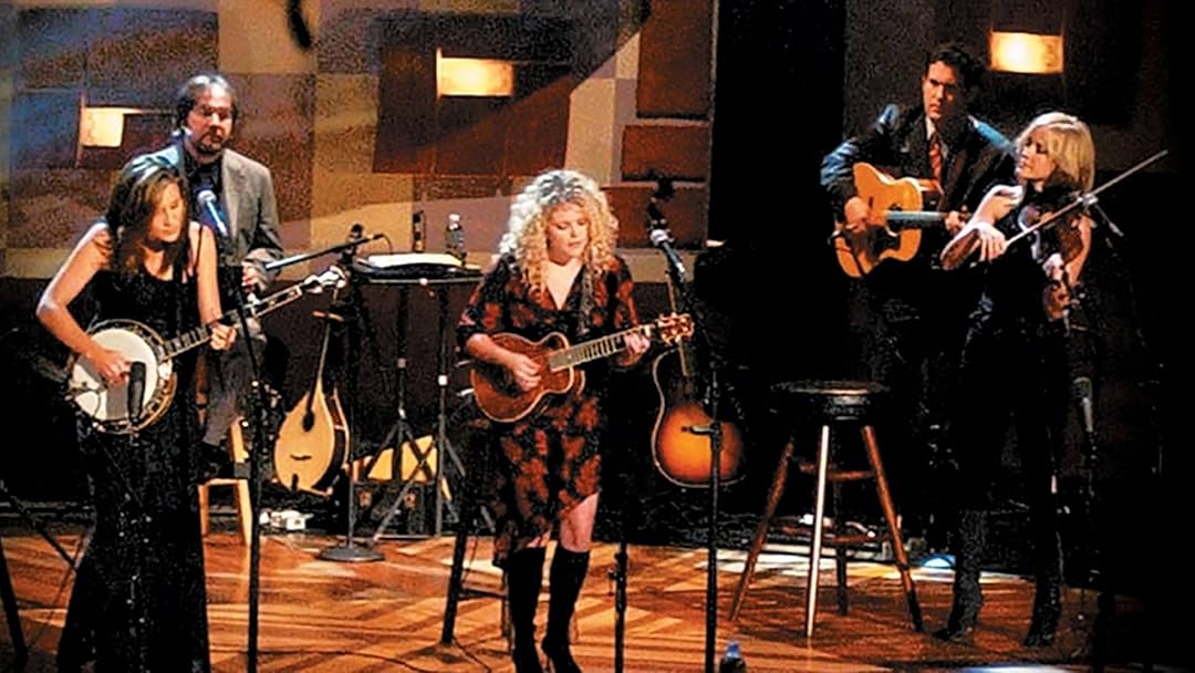 The Chicks performing live on stage with instruments