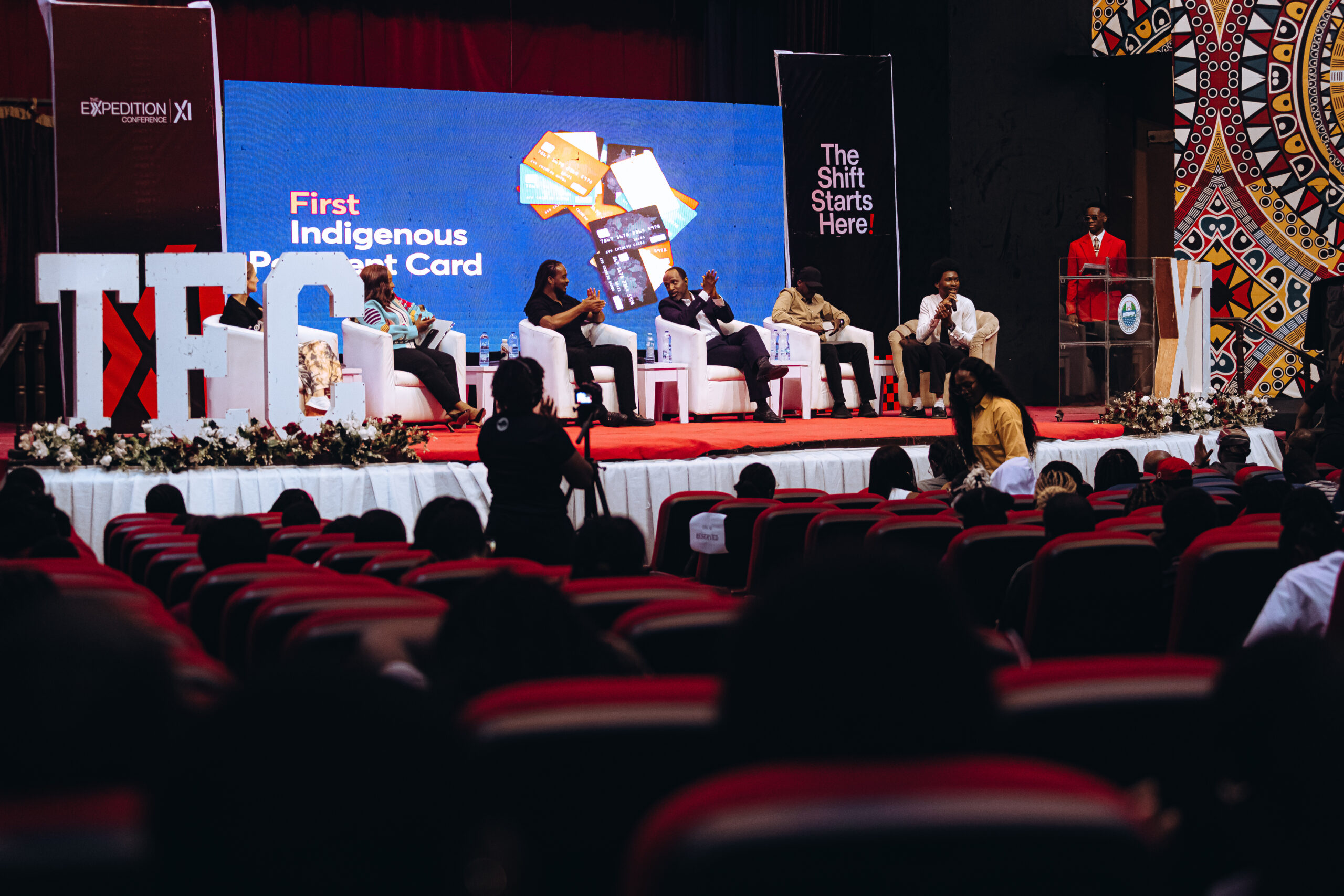 Panelists speaking on stage at The Expedition Conference Nigeria