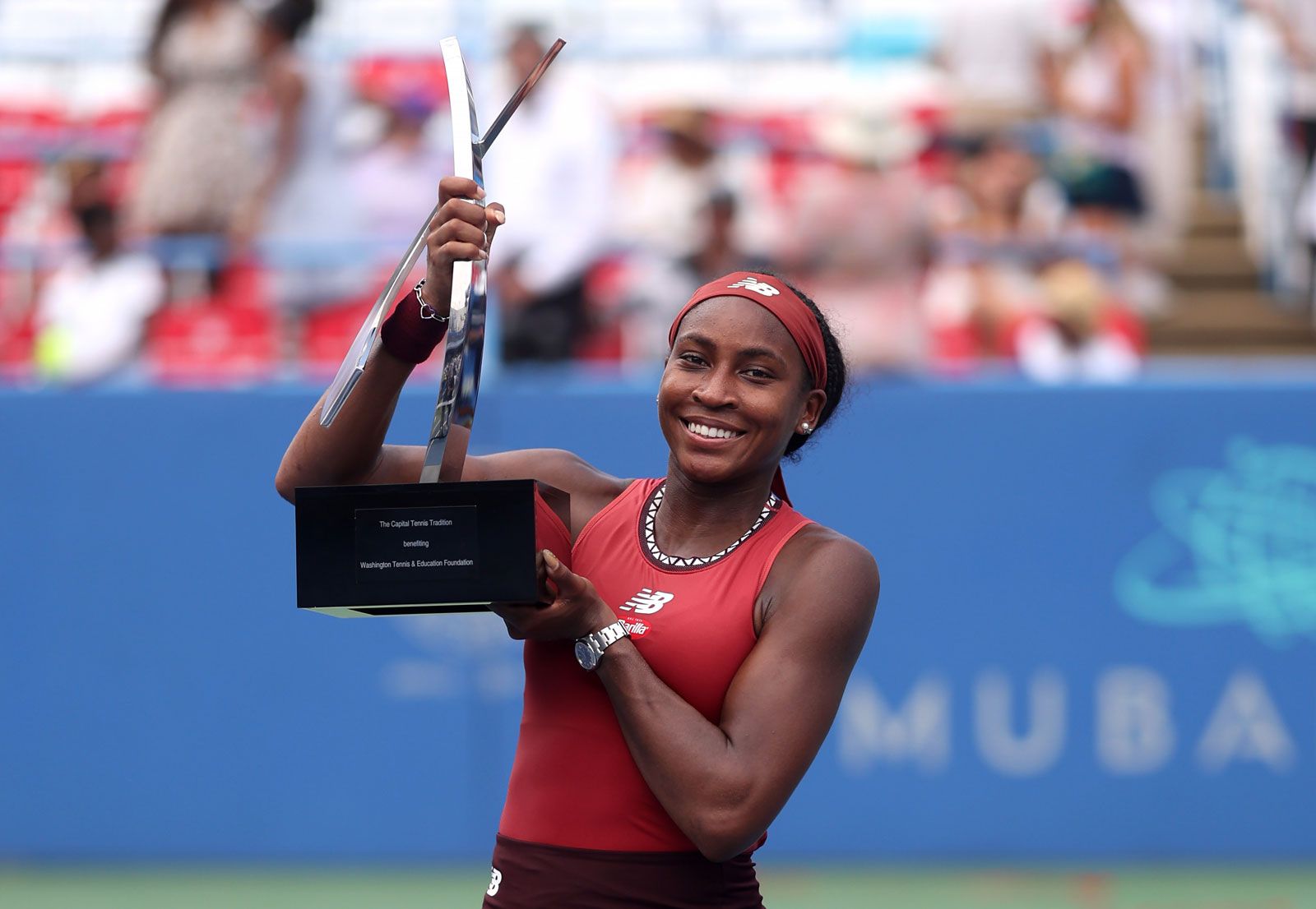 Coco Gauff holding the trophy after winning the 2023 US Open