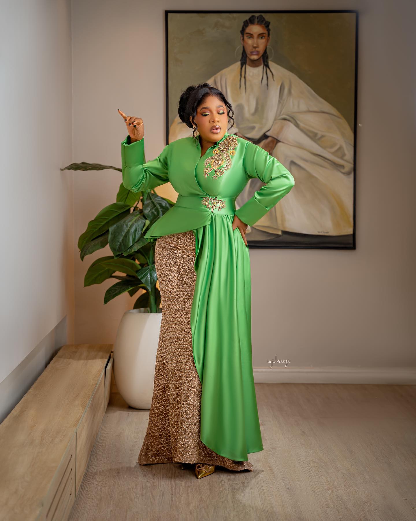 Toyin Abraham wearing apple green and gold outfit